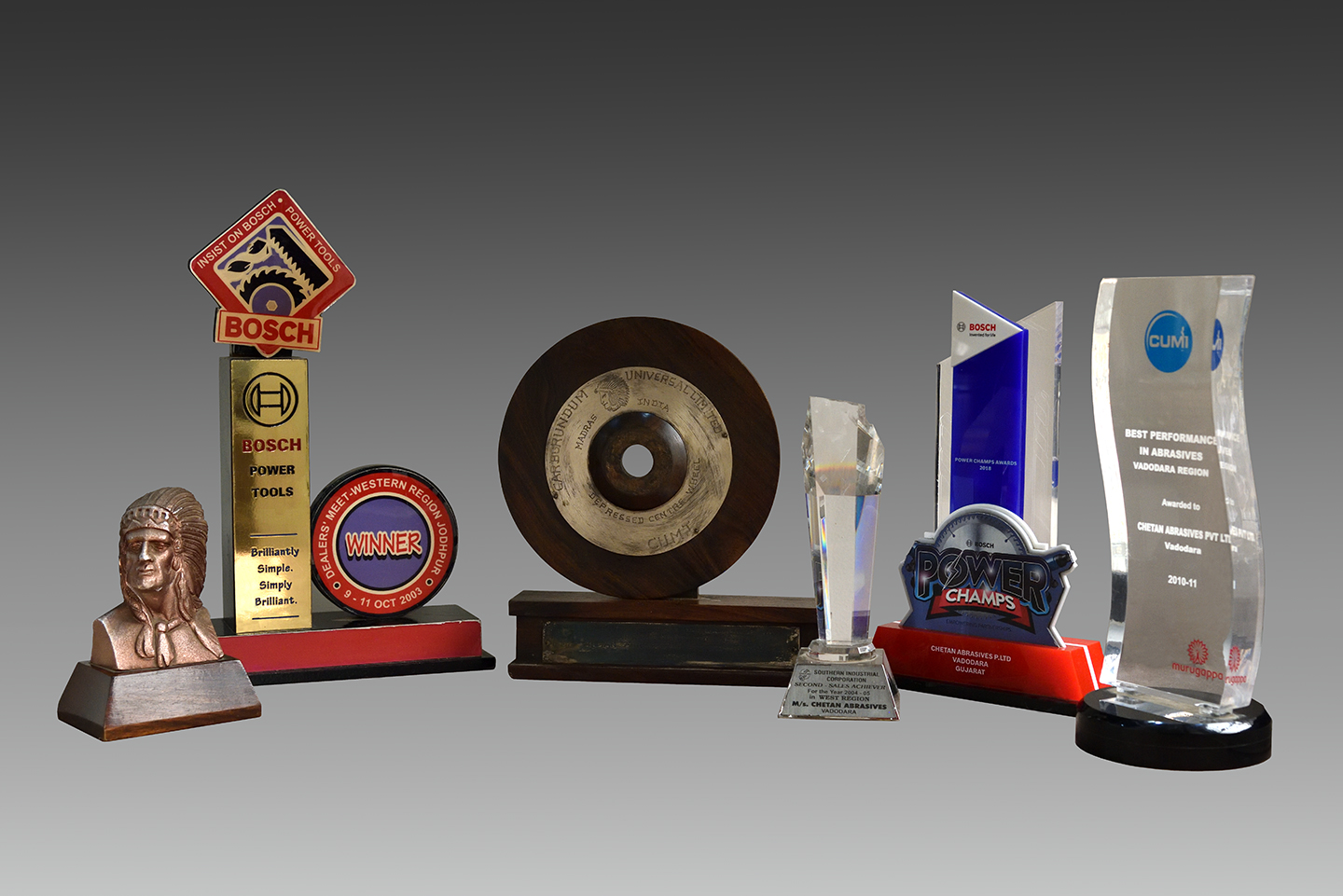Award trophies from Bosch, CUMI, and partners